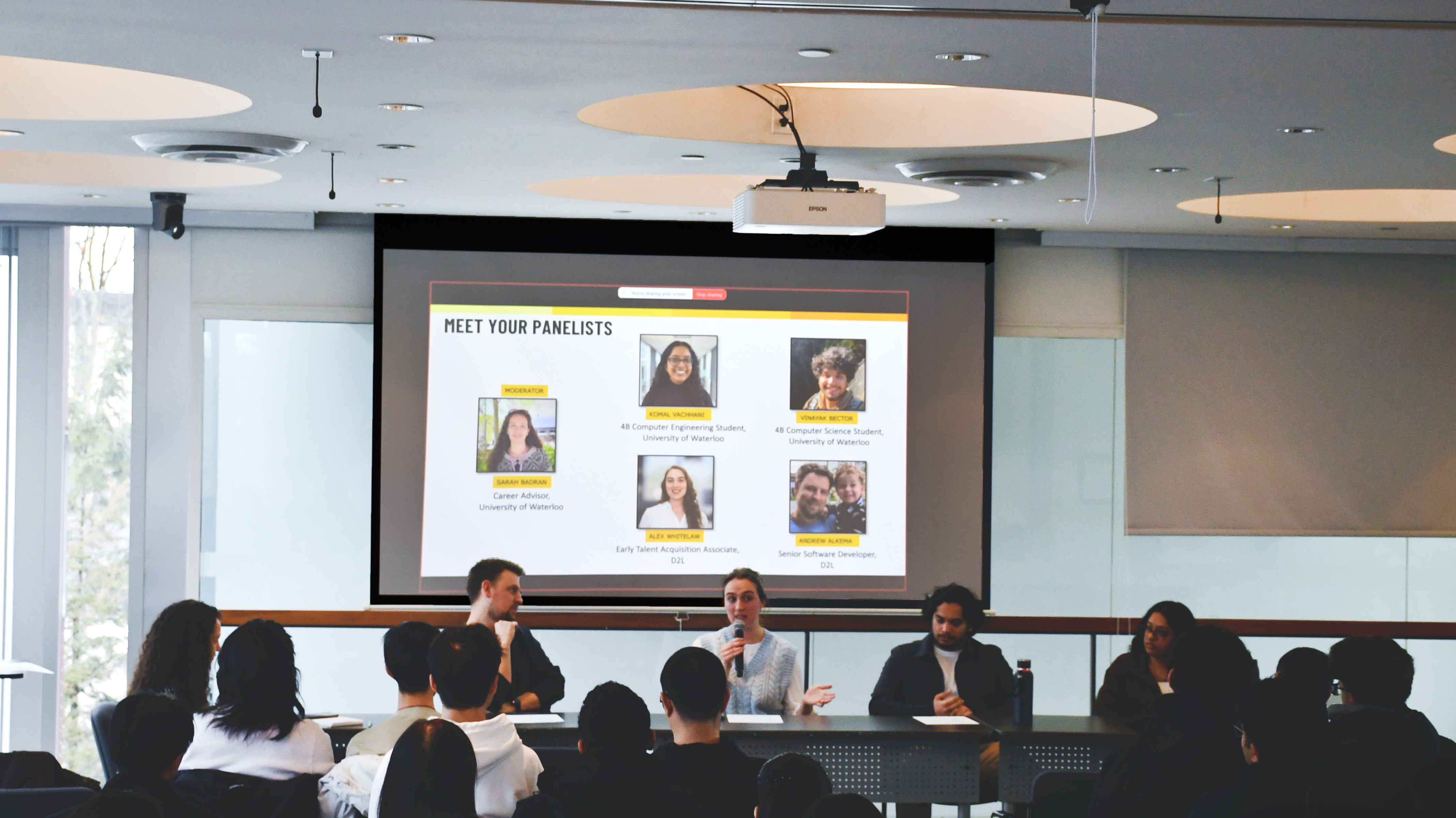 four people talking at a table
