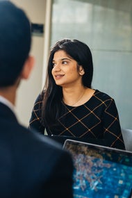 woman looking out window