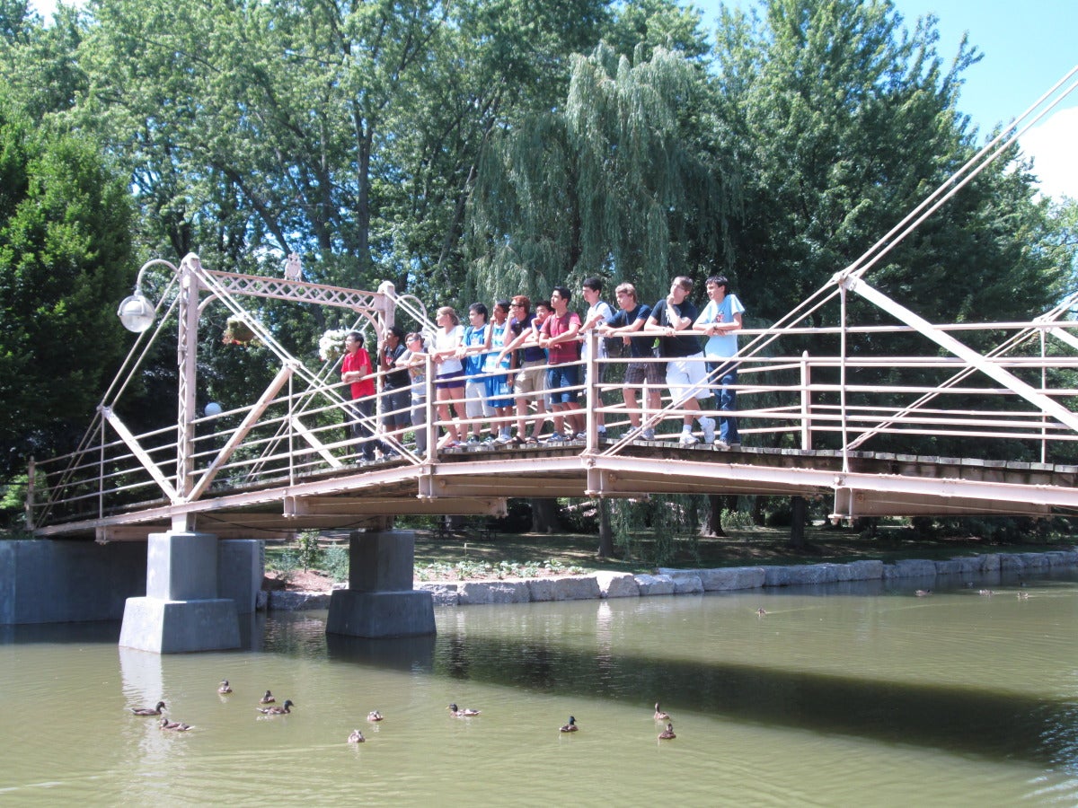 Summer Leadership program group photo on a bridge