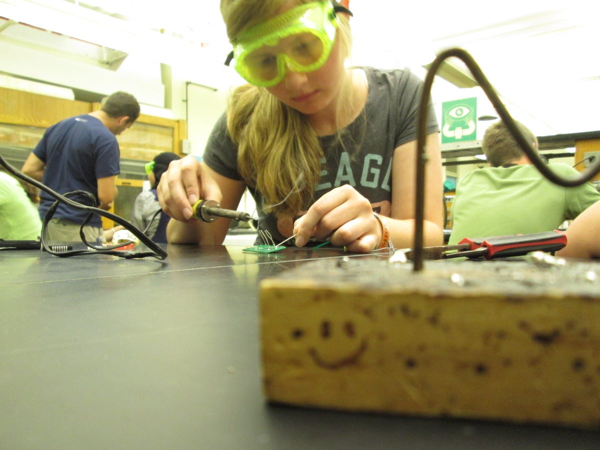 Summer Leadership participant conducting an experiment