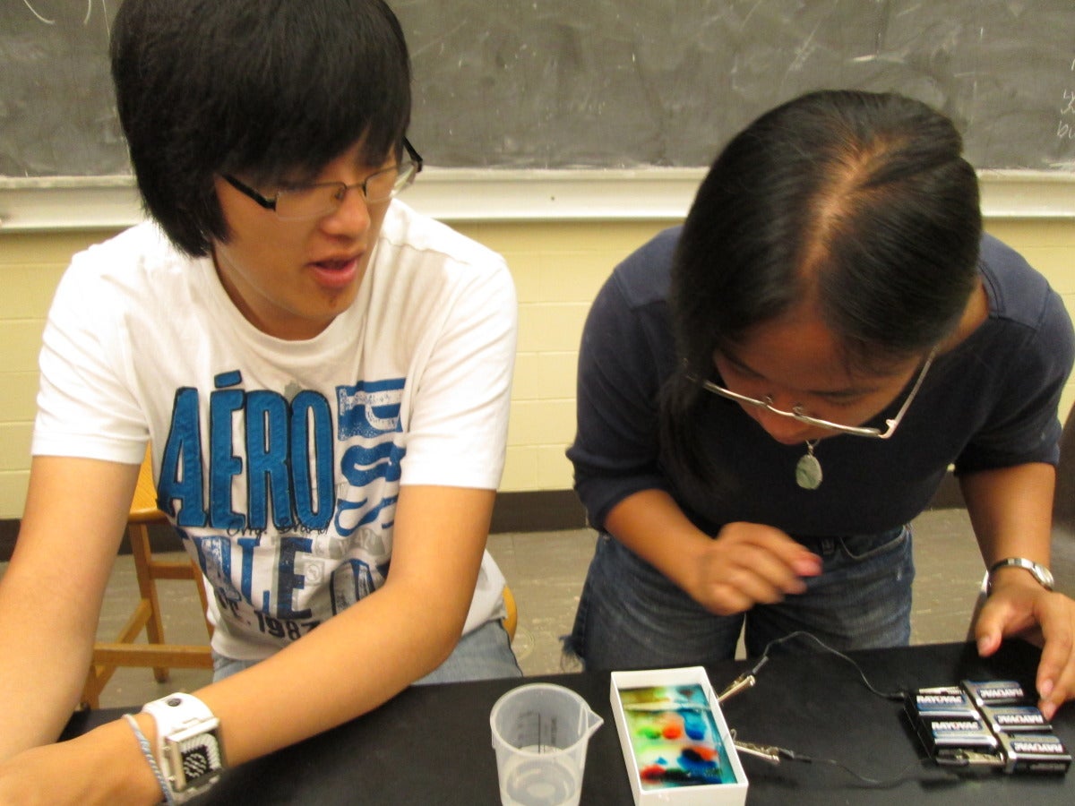 Summer Leadership participant conducting an experiment