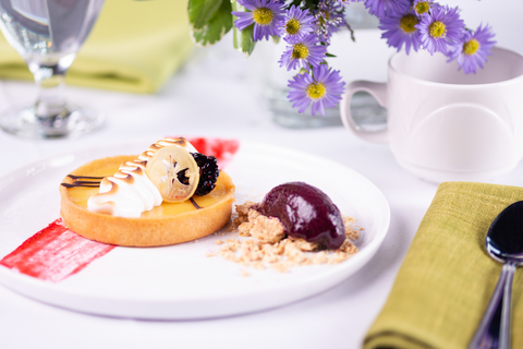 Lemon meringue tart with acai sorbet and blackberries