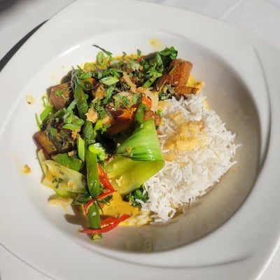 Thai vegetable curry with rice with tempeh, carrot, onion, eggplant, rappini, peppers over scented rice 