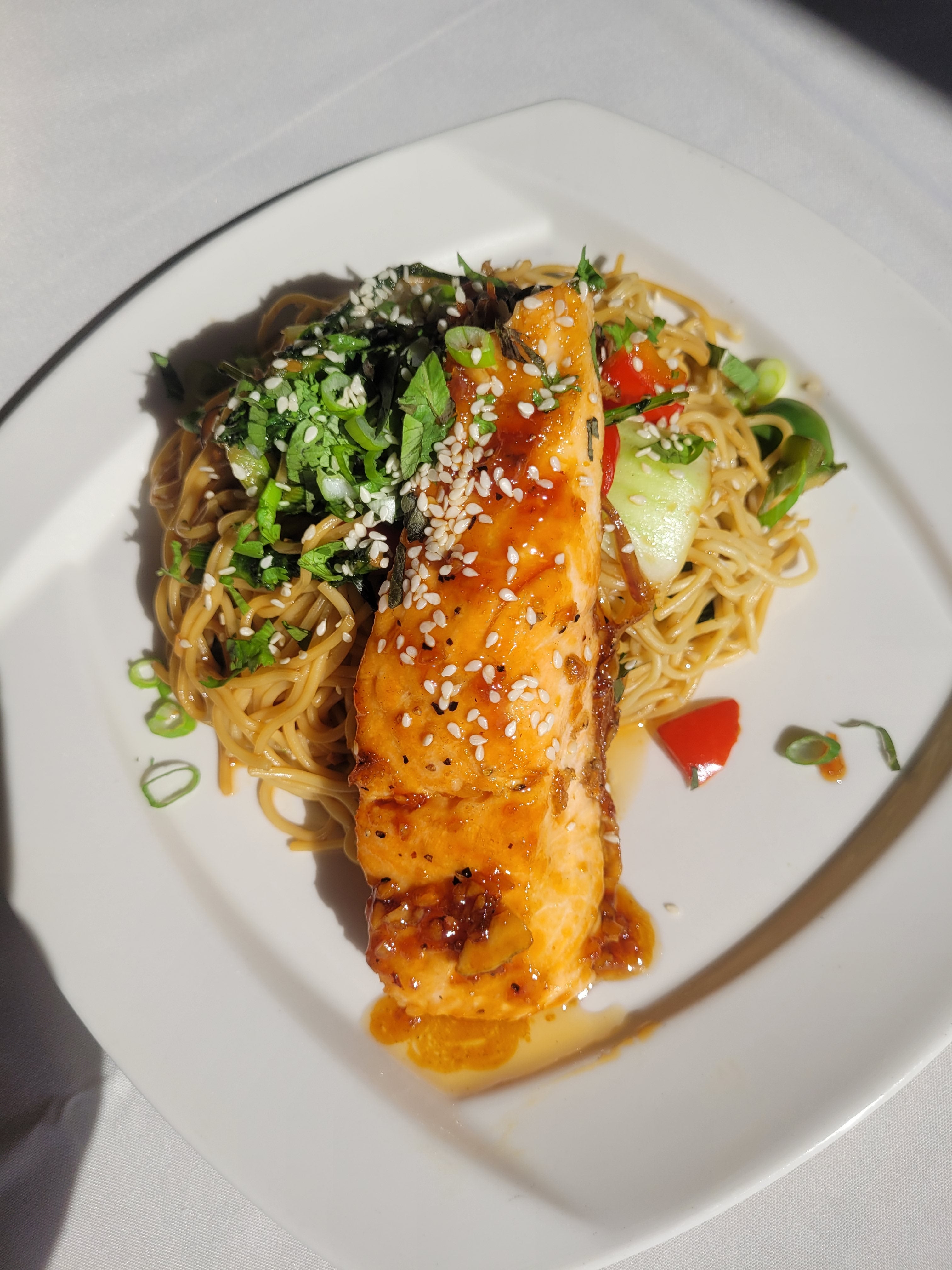 Seared Atlantic salmon with a honey garlic sauce, rappini & sesame noodles