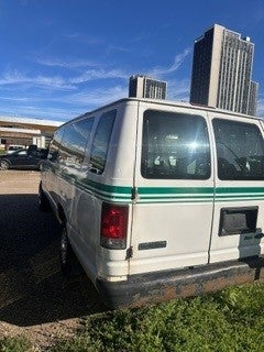 back of white van with green stripes