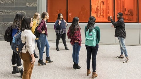 Visitors being given a tour of the IQC building.