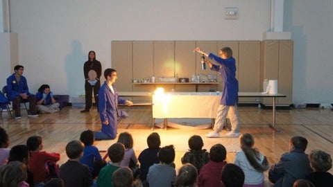 Propane bubble fire demonstration in front of children.
