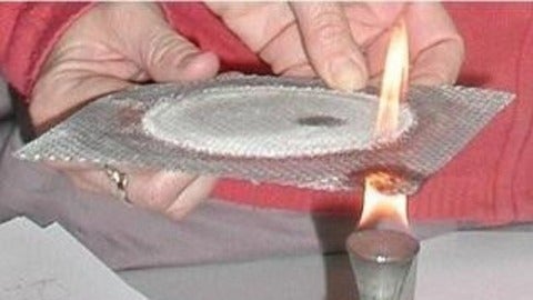 Wire gauze held over flame.