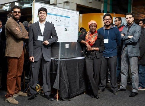 Picture of student team i front of their project