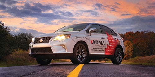 APMA connected car parked on road at sunrise