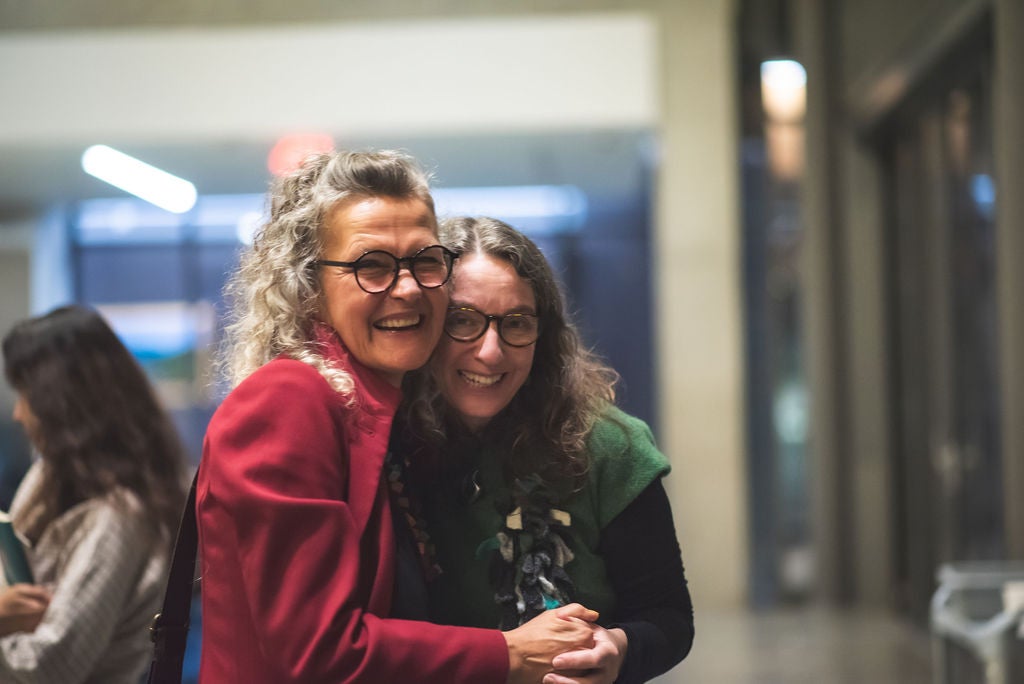 Barbara Schmenk and Alison Phipps hug after event