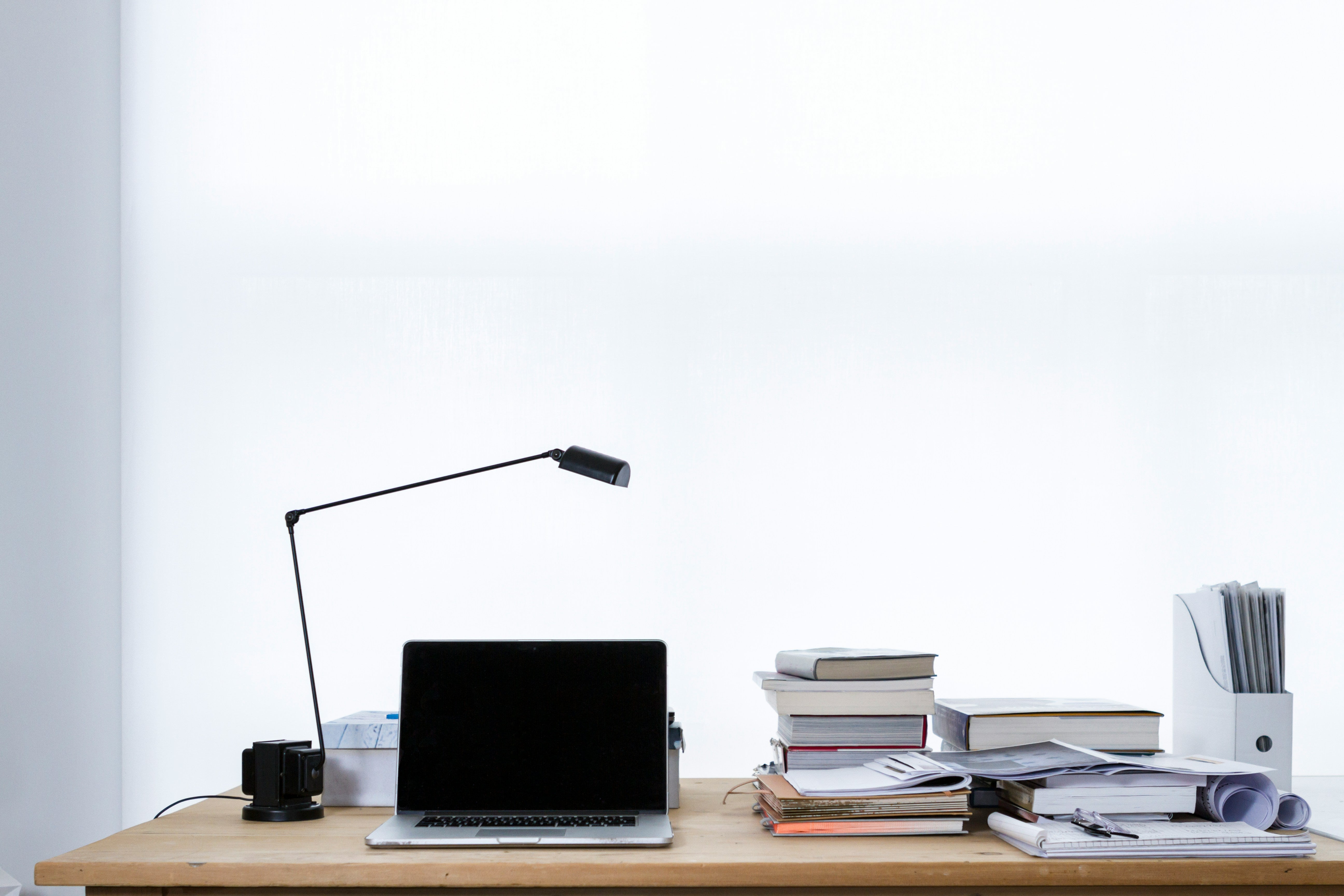 desk with computer and books