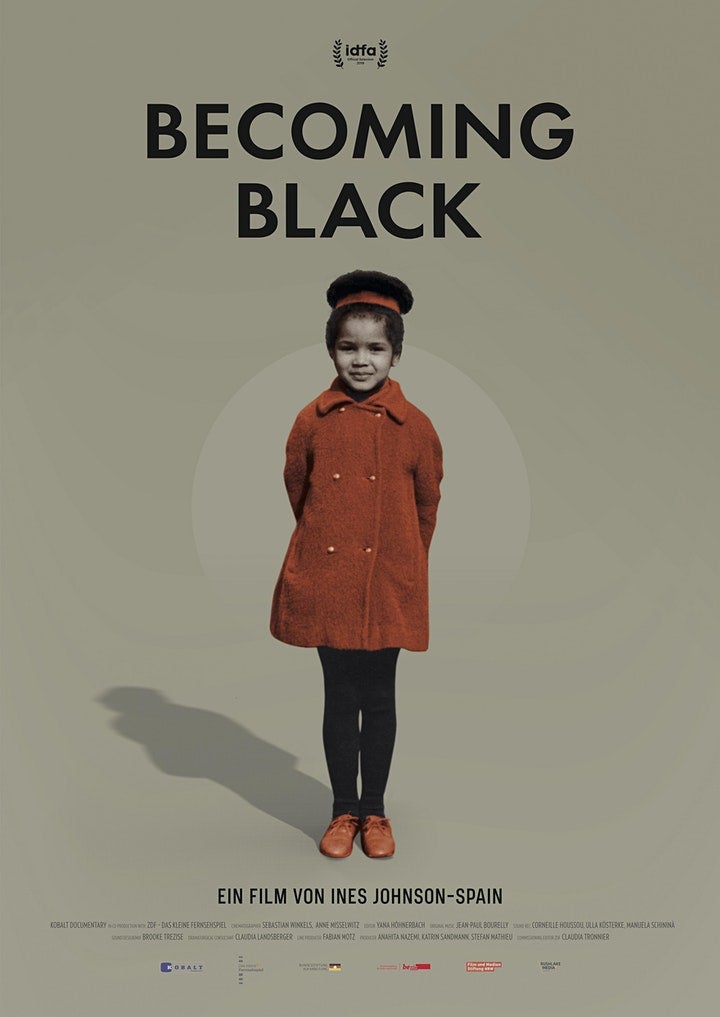Movie poster: Black girl wearing rust-coloured pea coat and matching shoes.