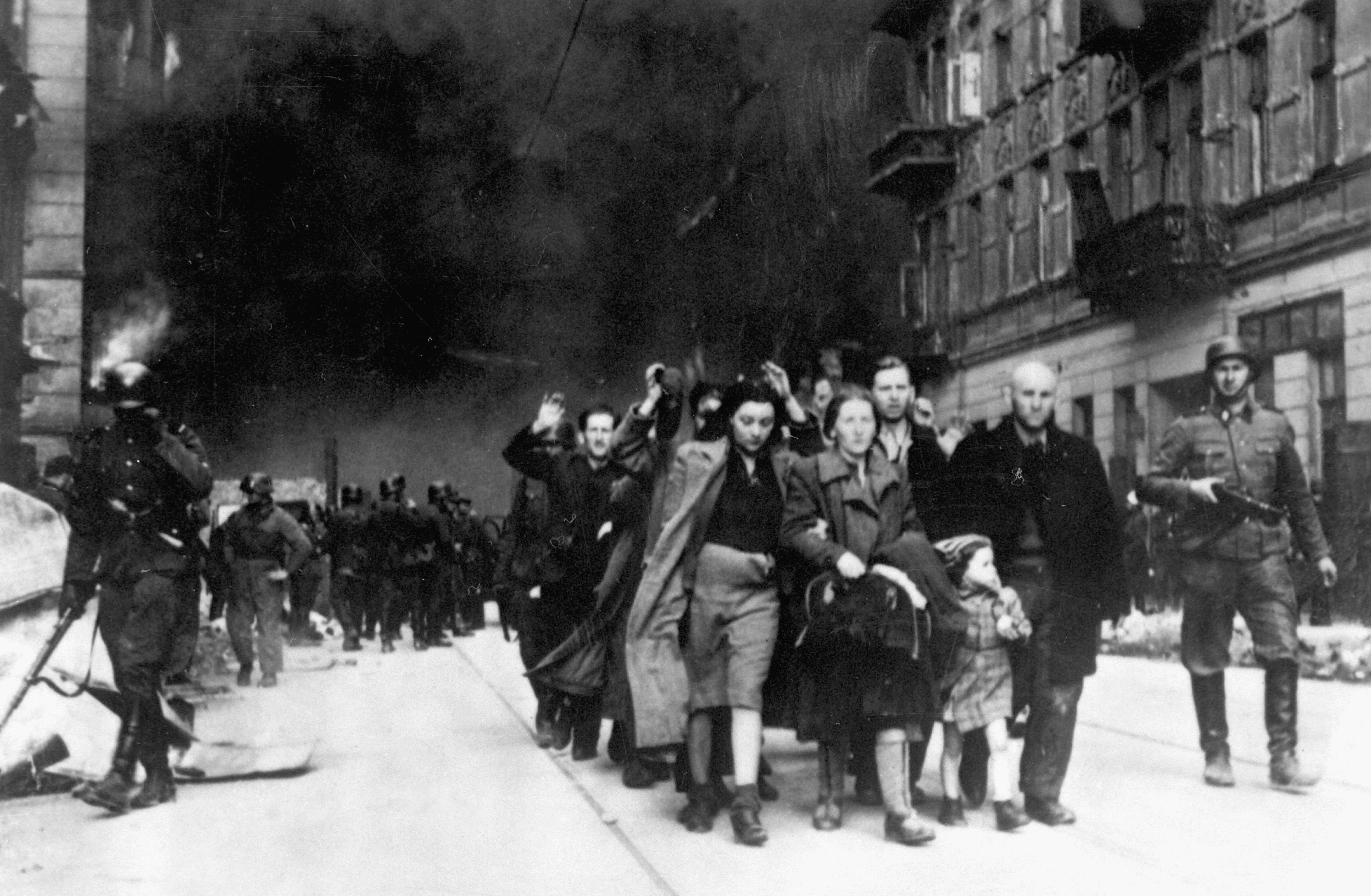 Jews in the Warsaw Ghetto are lead to a deportation point sometime between April 19 and May 16, 1943