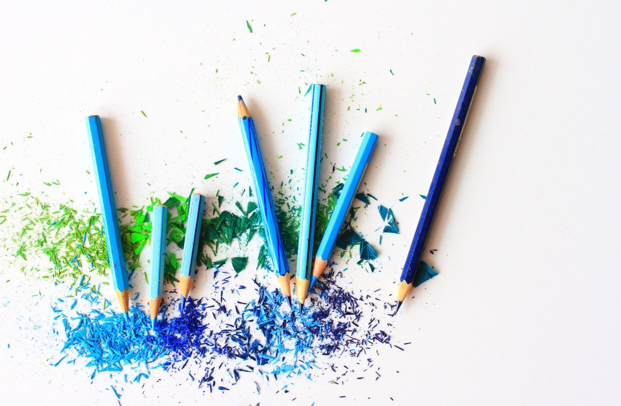 blue pencil crayons and shavings