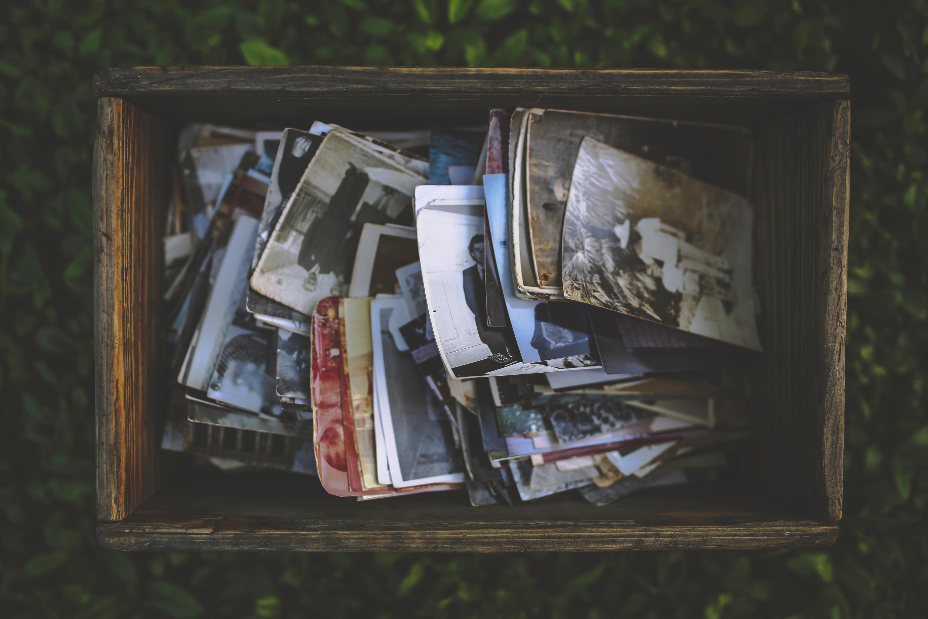 A box filled with old photographs