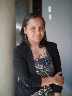 Women leaning against a wall 