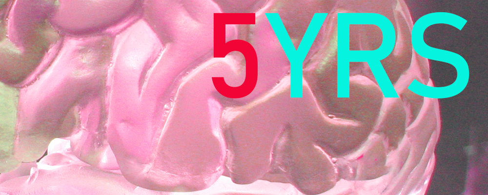close up of a pink brain surface with text "5YRS"