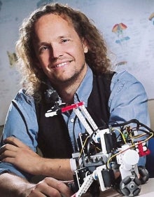 Chris Eliasmith with small robotic machine
