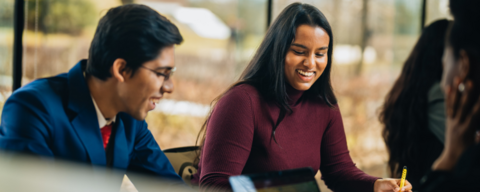 Two students sitting and working together in the Tatham Centre