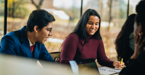 Two students sitting and working together in the Tatham Centre