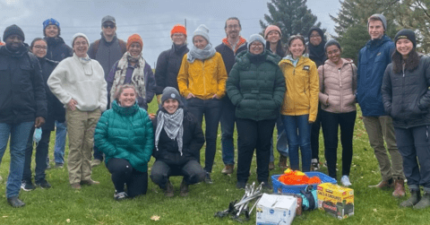 Volunteers posing for a photo at a tree planting eventing