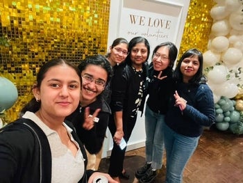 Volunteers posing for a photo at celebration