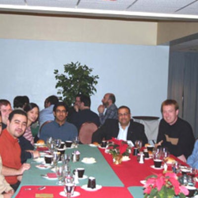 Several attendees with Dr. Raafat Mansour at lunch 2003
