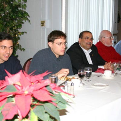 Group of male attendees at Christmas lunch 2005