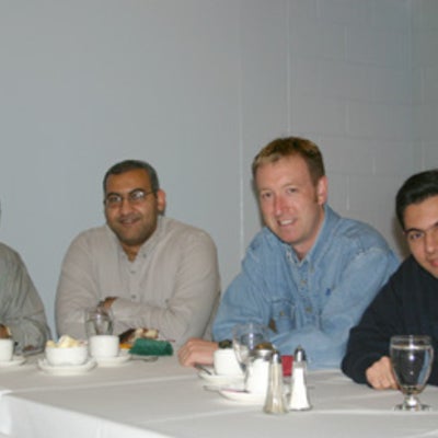 Four male attendees at Christmas lunch 2005