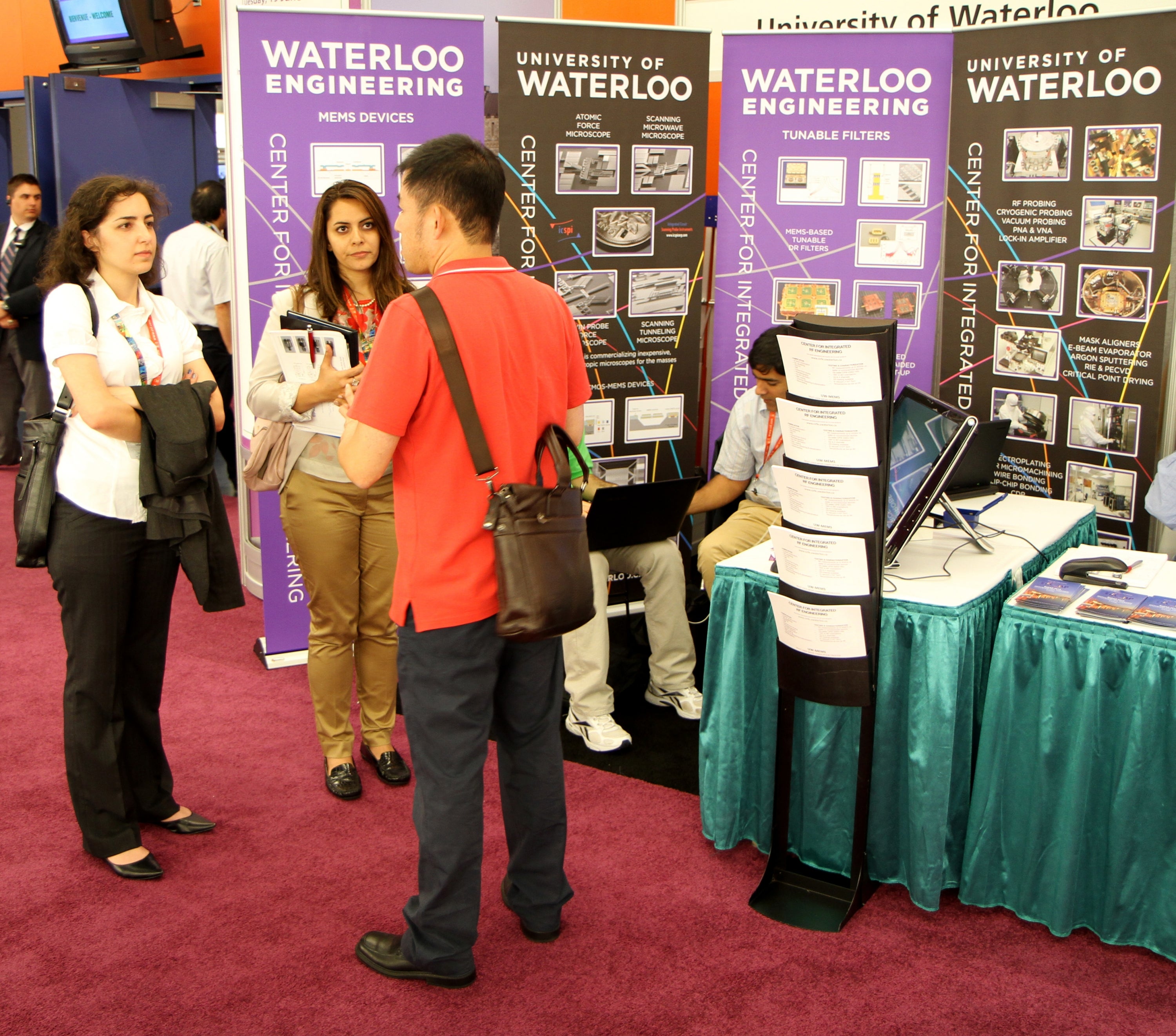 Students talking at booth