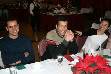 Three attendees having fun at the Christmas lunch 2005