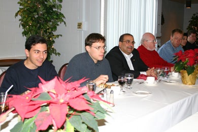 Group of male attendees at Christmas lunch 2005