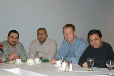Four male attendees at Christmas lunch 2005