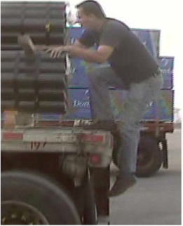 Man climbing onto trailer