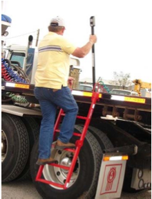 Man using deckmate ladder to climb onto side of trailer