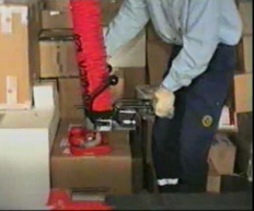 A worker using a vacuum hoist