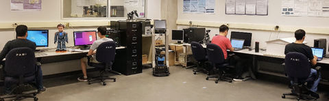 Students working on computers in the lab.