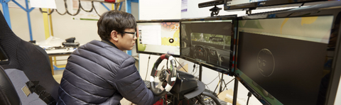 Student using driving simulator.