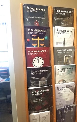 Ploughshares Monitor magazines on wall display