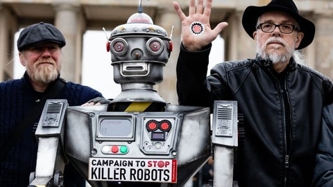 Men pose with robot for Campaign to Stop Killer Robots