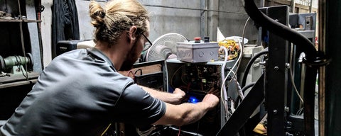 Jareb Baribeau wiring a machine