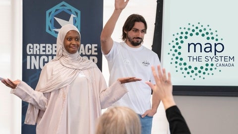 Two map the systems participants invite the audience to raise their hands