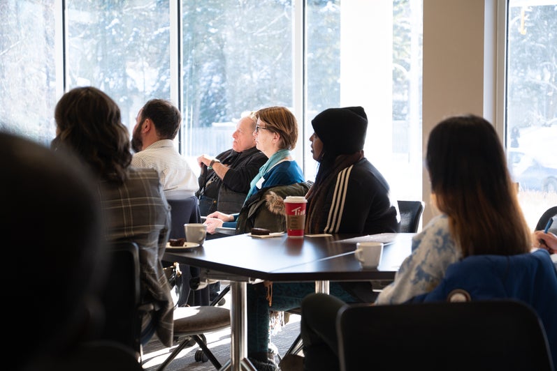 Participants watching the presentation