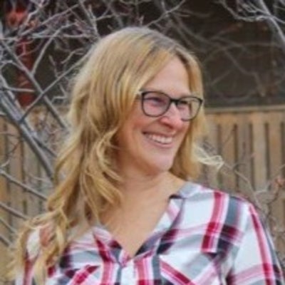 Heather outside smiling to the right