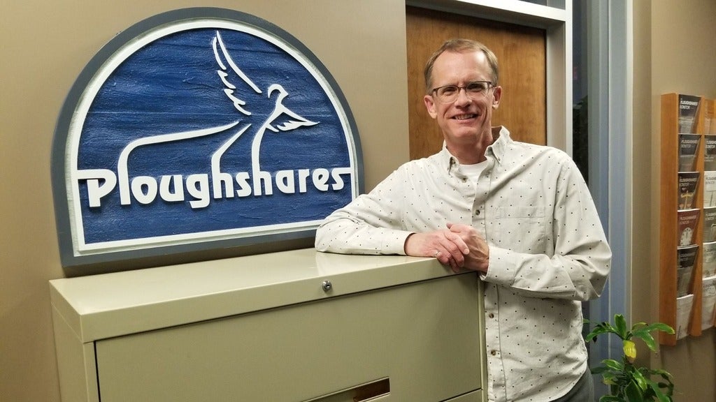 paul next to project ploughshares sign