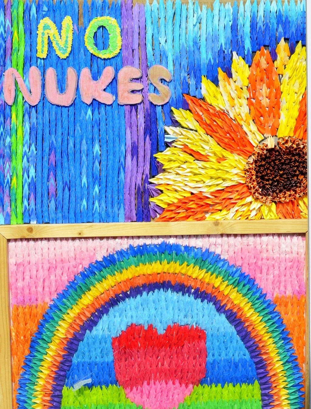 Sunflower street art saying "no nukes"