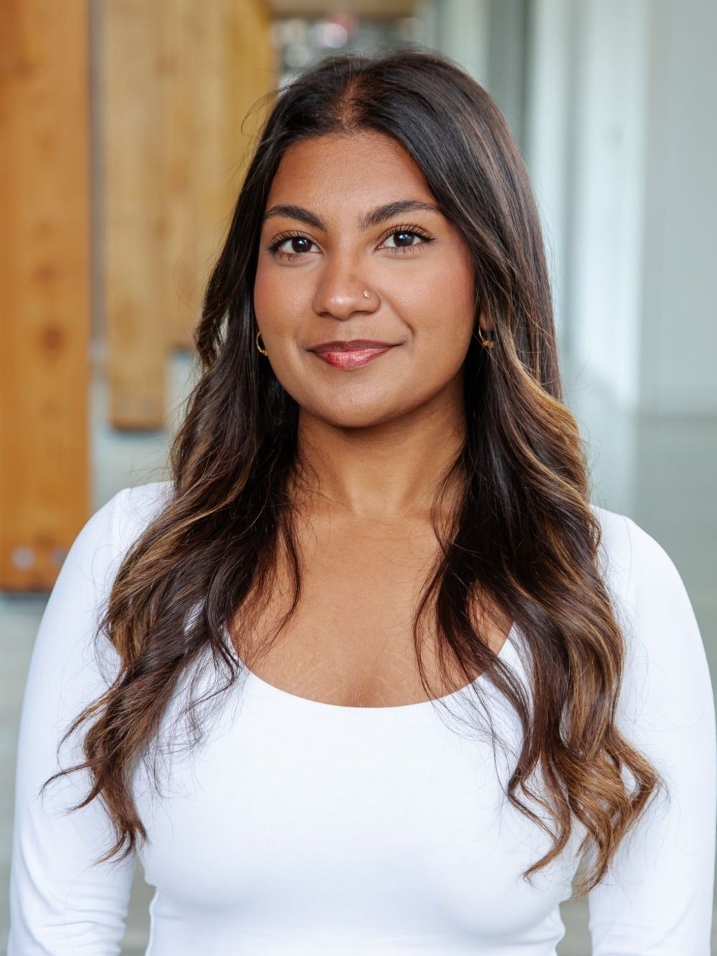 Prishaa Rajalathan in a white scoop-necked shirt