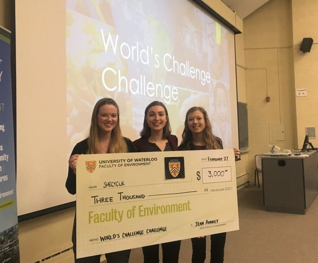 Abby Loewen, Anna Kuepfer and Leah Wouda hold first place prize of $3000 dollar cheque