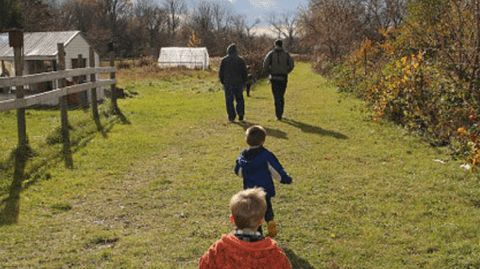 Family walking at Growing Hope Farm